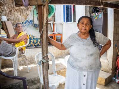 Carmela Medina and Alejandro Carranza, parents of Alejandro Carranza, a Colombian man who allegedly died when the U.S. bombed a boat supposedly carrying drugs in the Caribbean, pose for a photo at their house in Santa Marta on October 21, 2025.