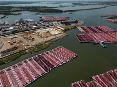 Barge traffic moves around the southern impoundment of the San Jacinto Waste Pits Superfund site on August 1, 2023, in Channelview, Texas.
