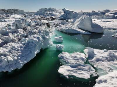 In this aerial view, melting icebergs crowd the Ilulissat Icefjord on July 16, 2024, near Ilulissat, Greenland.