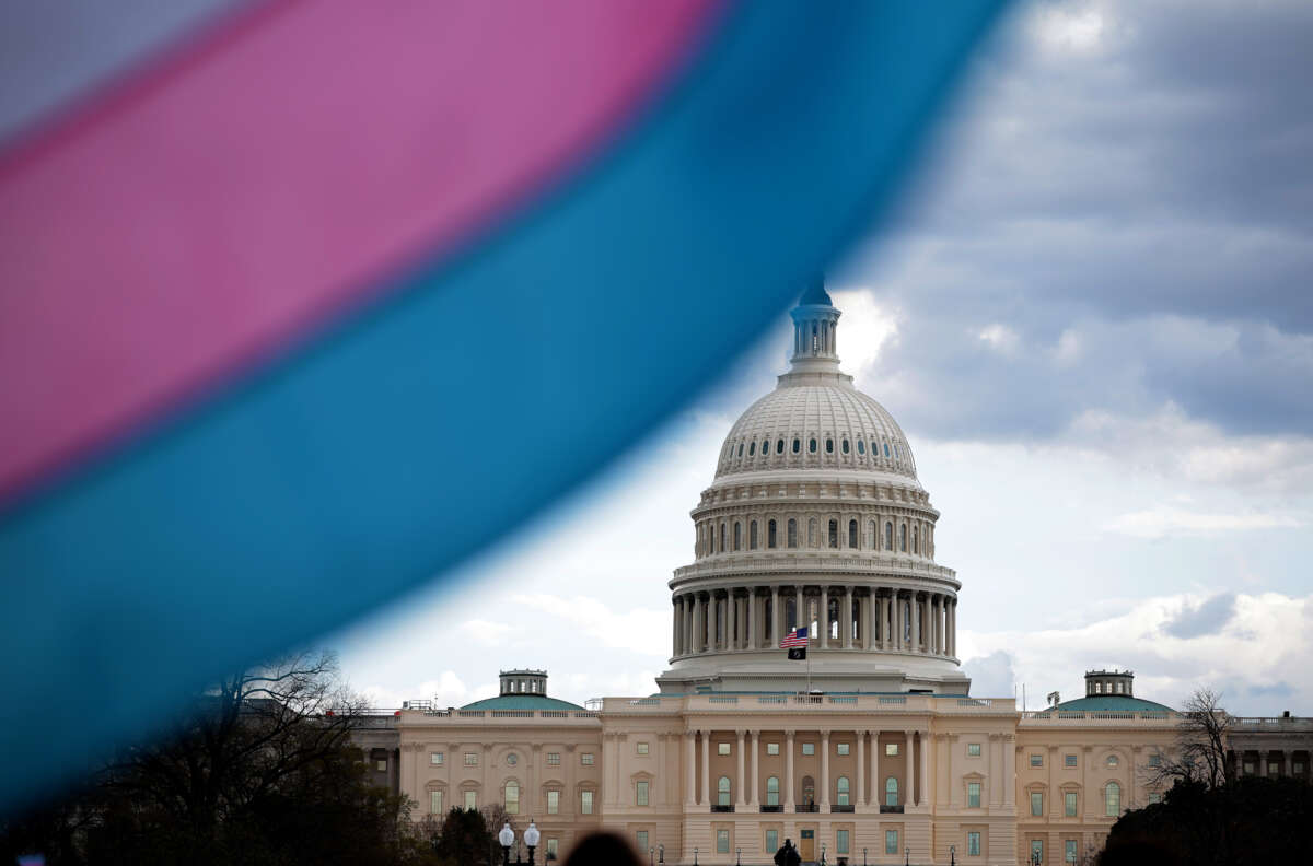 The U.S. Capitol Building is seen behind the Transgender Pride Flag during the Trans Day Of Visibility rally on the National Mall on March 31, 2025, in Washington, D.C.