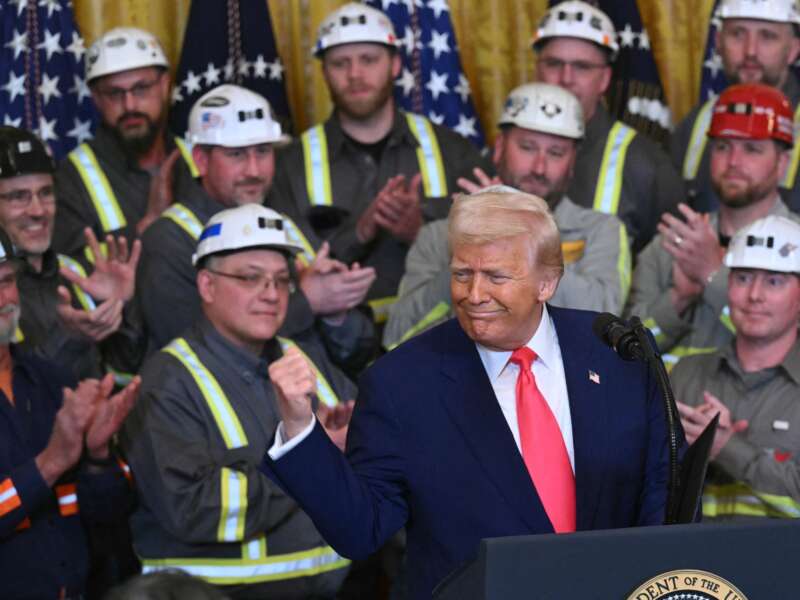 Donald Trump gestures before signing an executive order to boost coal mining and production in the United States, in the East Room of the White House on April 8, 2025, in Washington, D.C.