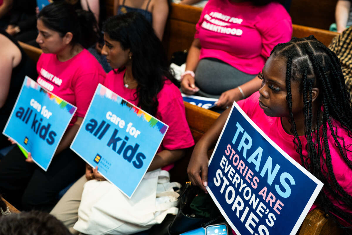 Families, advocates, and allies of transgender youth rally at the Lutheran Church of the Reformation in Washington, D.C., on June 18, 2025.