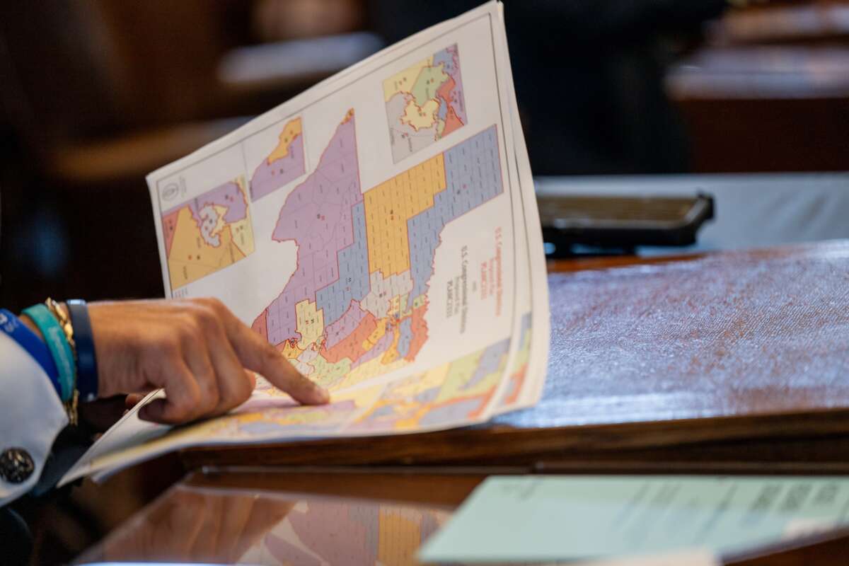 Texas Republican Rep. Marc LaHood views a map during a House meeting in the State Capitol on August 20, 2025, in Austin, Texas. Texas lawmakers convened during a second special session over a plan to redraw Texas's congressional maps ahead of the 2026 midterm elections.