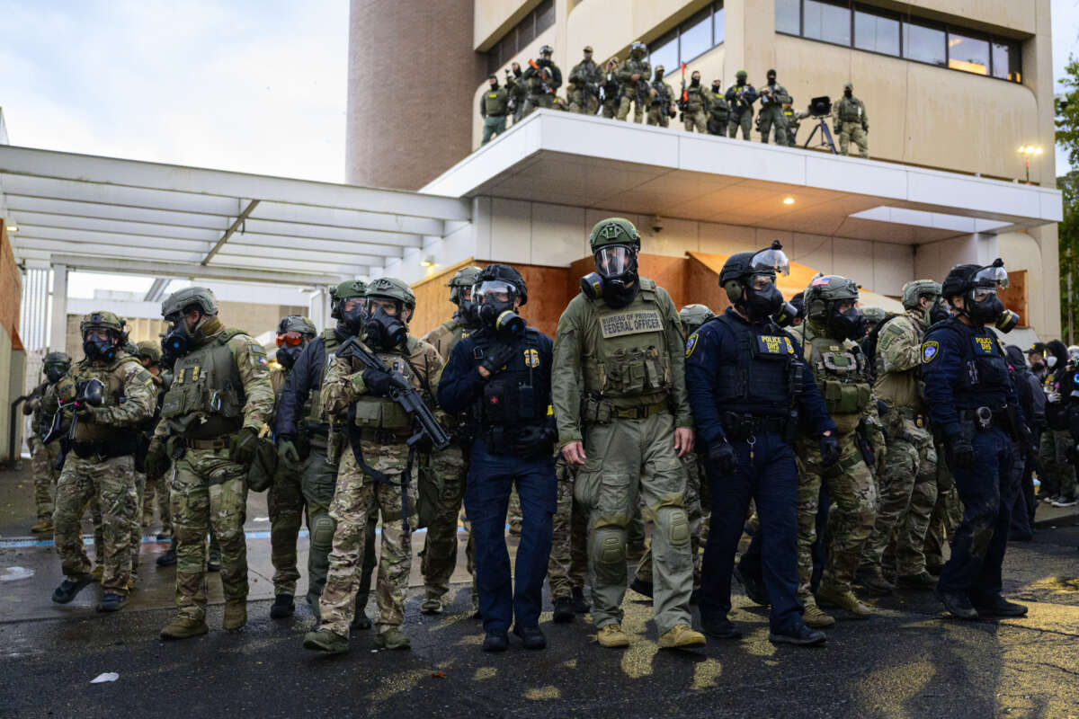 Federal agents clash with anti-ICE protesters at the U.S. Immigration and Customs Enforcement building on October 12, 2025, in Portland, Oregon.