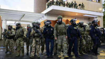 Federal agents clash with anti-ICE protesters at the U.S. Immigration and Customs Enforcement building on October 12, 2025, in Portland, Oregon.