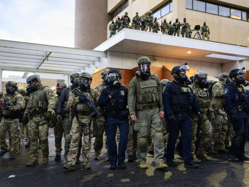 Federal agents clash with anti-ICE protesters at the U.S. Immigration and Customs Enforcement building on October 12, 2025, in Portland, Oregon.