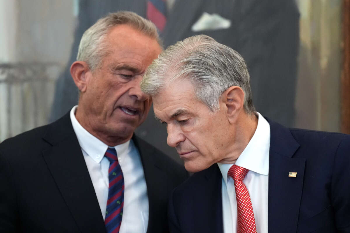 U.S. Health and Human Services Secretary Robert F. Kennedy Jr. (L) talks with Administrator for the Centers for Medicare & Medicaid Services Dr. Mehmet Oz while President Donald Trump delivers remarks in the Oval Office at the White House on November 6, 2025, in Washington, D.C.