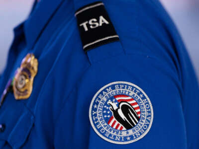 A detailed view of a Transportation Security Administration (TSA) patch on an employee&#039;s shirt at Orlando International Airport (MCO) on November 9, 2025, in Orlando, Florida.