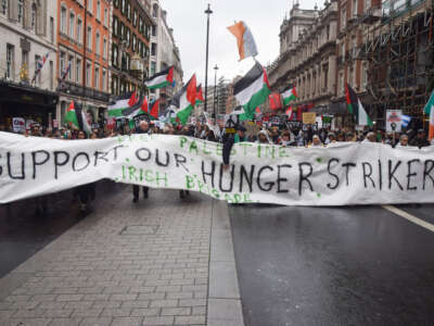 Protesters hold a banner in support of the Palestine Action activists who are part of the group known as the 'Filton 24', who were arrested following a protest action at a facility owned by arms manufacturers Elbit Systems and who are currently on hunger strike, during a demonstration in Piccadilly as thousands of people march in support of Palestine in London, UK, on November 29, 2025.