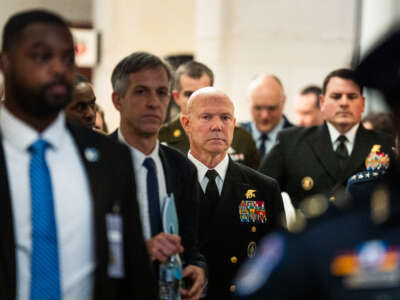 Navy Admiral Frank Bradley makes his way to another closed door classified meeting with lawmakers in Washington, D.C., on December 4, 2025.