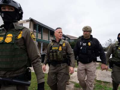 Border Patrol Commander Gregory Bovino (center) leads an immigration raid in Kenner, Louisiana, on December 5, 2025.