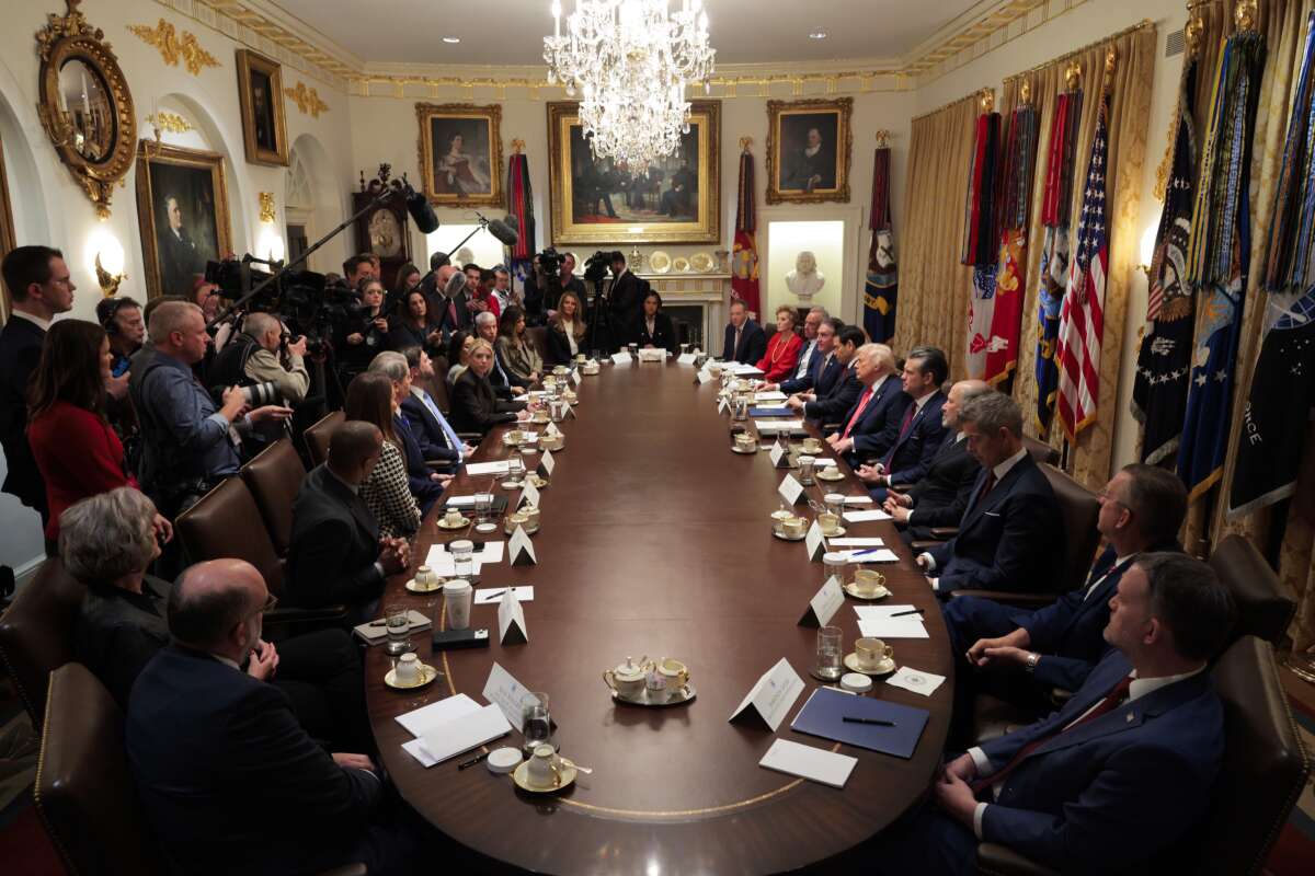Donald Trump holds a meeting of his cabinet in the Cabinet Room of the White House on December 2, 2025, in Washington, D.C. A bipartisan congressional investigation has begun regarding Secretary of War Pete Hegseth's role in ordering U.S. military strikes on small boats in the waters off Venezuela that have killed scores of people.