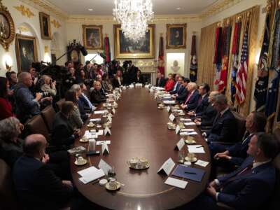 Donald Trump holds a meeting of his cabinet in the Cabinet Room of the White House on December 2, 2025, in Washington, D.C. A bipartisan congressional investigation has begun regarding Secretary of War Pete Hegseth's role in ordering U.S. military strikes on small boats in the waters off Venezuela that have killed scores of people.