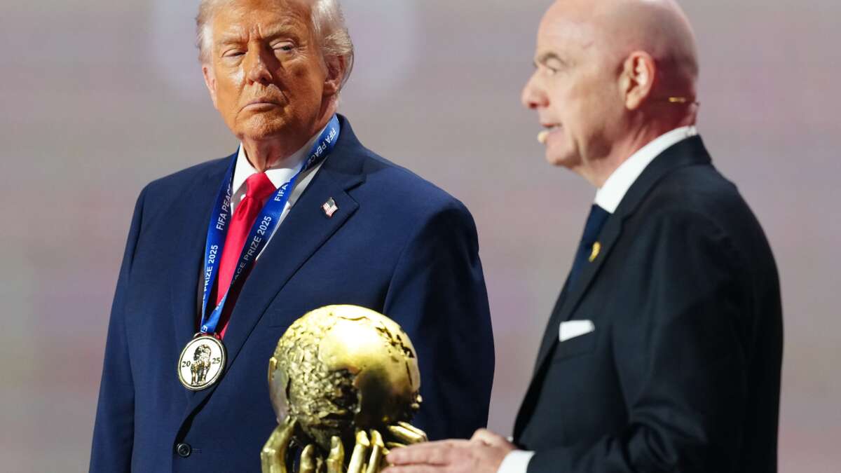 Donald Trump receives the FIFA Peace Prize from Gianni Infantino, president of FIFA, during the FIFA World Cup 2026 Official Draw at John F. Kennedy Center for the Performing Arts in Washington, D.C., on December 5, 2025.