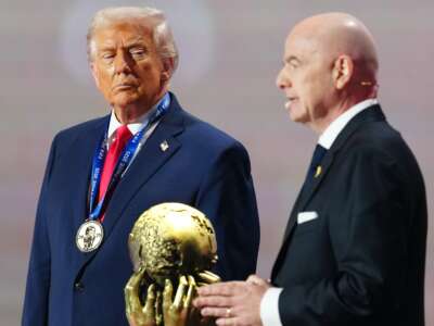 Donald Trump receives the FIFA Peace Prize from Gianni Infantino, president of FIFA, during the FIFA World Cup 2026 Official Draw at John F. Kennedy Center for the Performing Arts in Washington, D.C., on December 5, 2025.