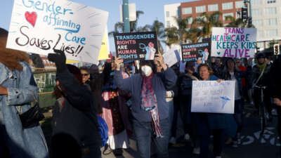 Members of Rainbow Families Action march from Bay Street in Emeryville, California, on December 8, 2025 to the Sutter corporate offices on Powell Street to protest the end of gender-affirming care to patients under age 19.