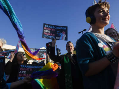 Members of Rainbow Families Action march from Bay Street in Emeryville, California, on December 8, 2025, to the Sutter corporate offices on Powell Street to protest the end of gender-affirming care for patients under age 19.