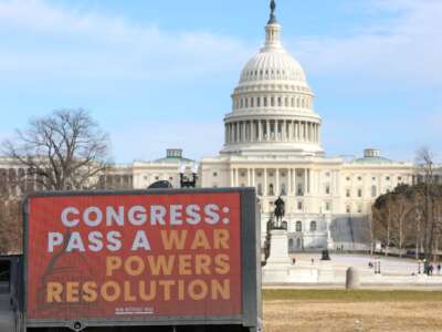 A mobile billboard sponsored by Win Without War is seen outside the U.S. Capitol Building on December 15, 2025, in Washington, D.C.