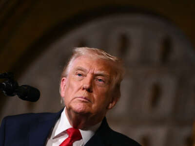 U.S. President Donald Trump takes questions from journalists after announcing the U.S. Navy's new Golden Fleet initiative, unveiling a new class of warships, at Mar-a-Lago in Palm Beach, Florida, on December 22, 2025.