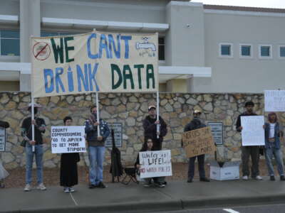Protesters outside the Doña Ana County Government Center in Las Cruces, New Mexico, before a Doña Ana County Board of County Commissioners vote on Project Jupiter on September 19, 2025.
