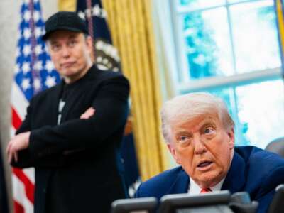 U.S. President Donald Trump speaks during a news conference with Elon Musk (L) in the Oval Office of the White House in Washington, D.C., on May 30, 2025.