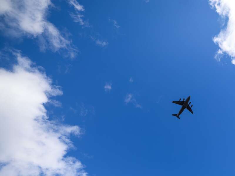 A U.S. Air Force flyover featuring a C-17 cargo plane passes over Lane Stadium as fans look on before kickoff between the Virginia Tech Hokies and Miami Hurricanes on November 22, 2025 in Blacksburg, Virginia.