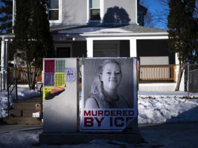 A poster reads "Murdered by ICE" near the site where Renee Good was killed a week ago on January 14, 2026 in Minneapolis, Minnesota.