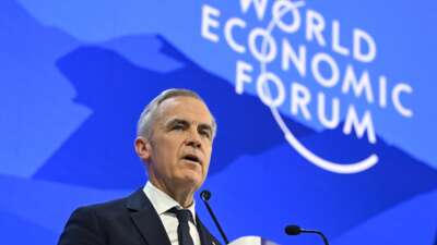 Canada's Prime Minister Mark Carney delivers a speech during the World Economic Forum annual meeting in Davos on January 20, 2026.