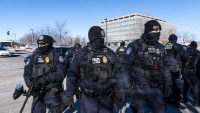 Department of Homeland Security police officers arrest a person outside of the Bishop Henry Whipple Federal Building on January 14, 2026 in Minneapolis, Minnesota.