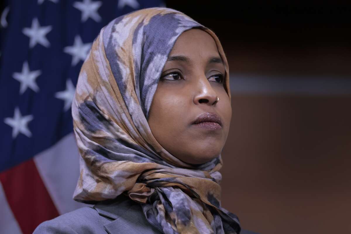 Rep. Ilhan Omar (D-Minnesota), Deputy Chair of the Congressional Progressive Caucus, listens to other members of the CPC at a press conference at the U.S. Capitol on January 13, 2026 in Washington, D.C.