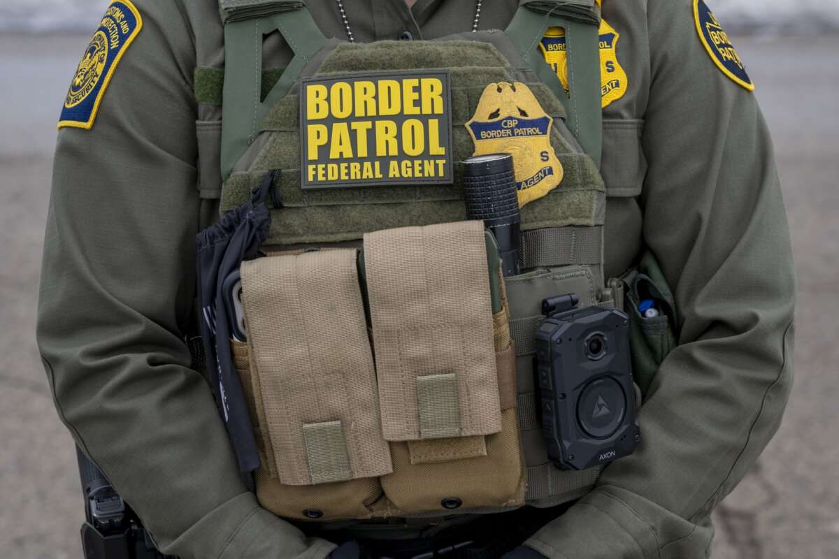 Closeup of Border Patrol agent's gear at protest at the Whipple Federal building in response to the killing of a woman by an Immigration and Customs Enforcement officer.