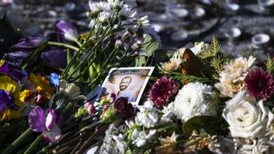 A portrait stands at a memorial for Alex Pretti on January 25, 2026 in Minneapolis, Minnesota.