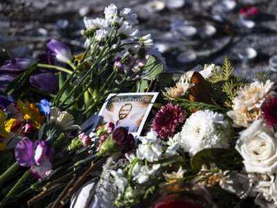 A portrait stands at a memorial for Alex Pretti on January 25, 2026 in Minneapolis, Minnesota.