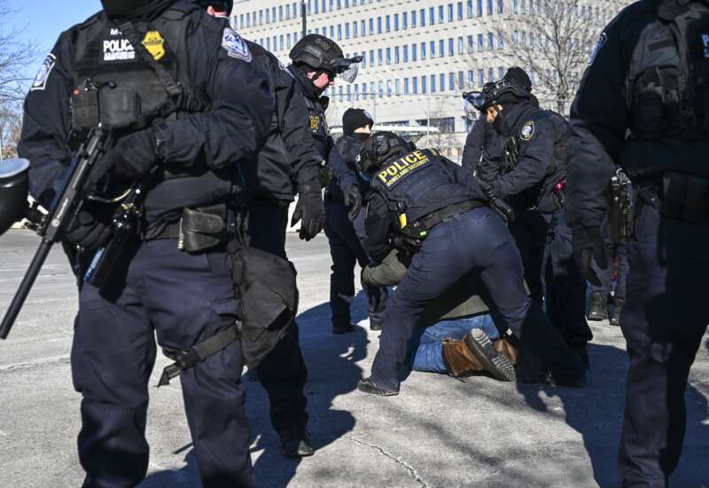Department of Homeland Security police officers arrest a person outside of the Bishop Henry Whipple Federal Building on January 14, 2026 in Minneapolis, Minnesota.