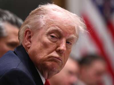 President Donald Trump listens during a cabinet meeting in the Cabinet Room of the White House in Washington, D.C., on January 29, 2026.