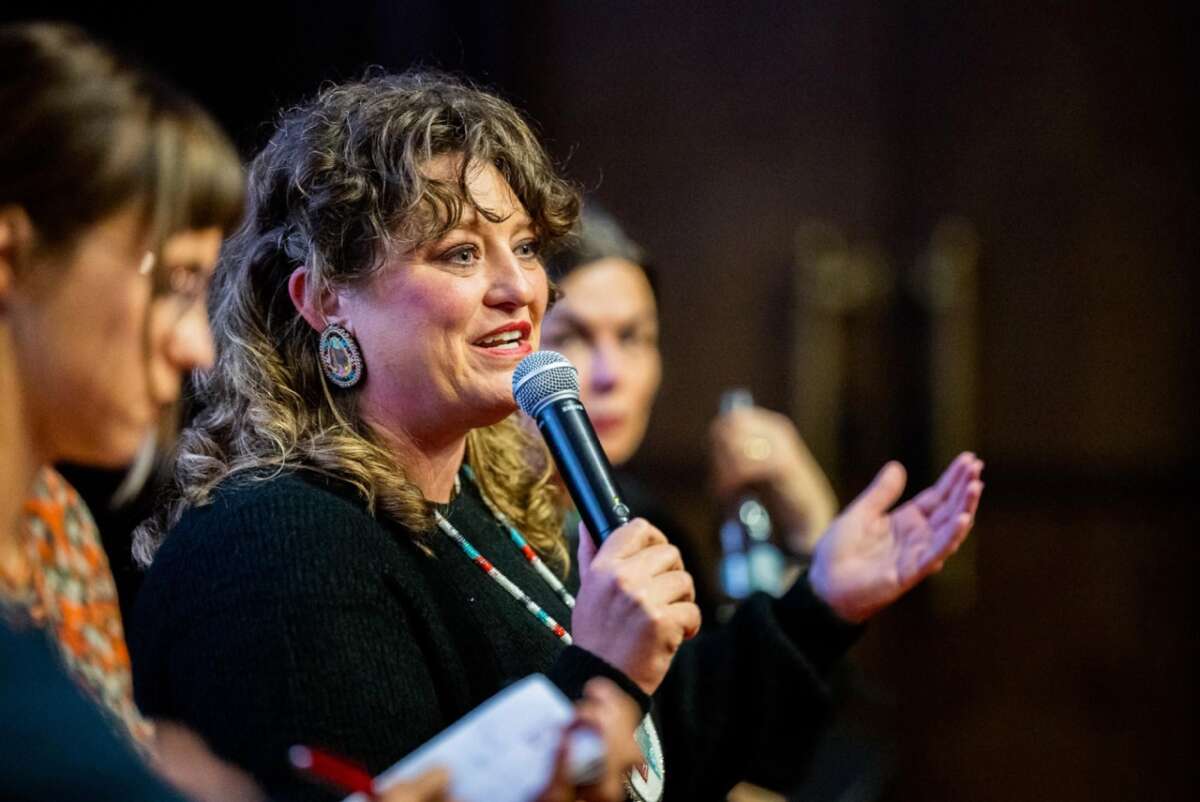 Angel Ellis speaking at the Millennium Docs Against Gravity Film Festival in Poland, 2023, where the documentary Bad Press was screened.