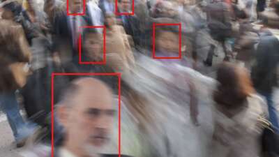 Facial recognition used on pedestrians in a crowd