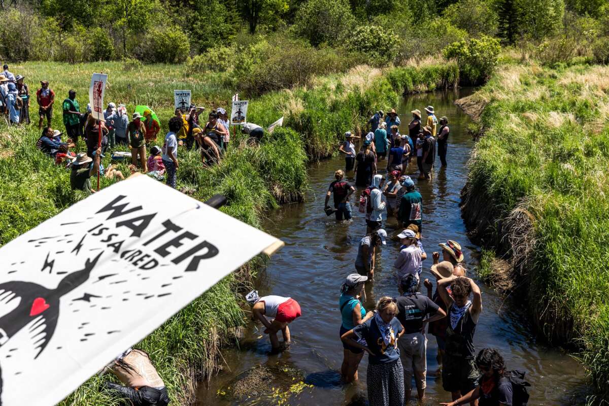 Indigenous community members and climate activists gather on the river for a traditional water ceremony during a rally and march to protest the construction of the Enbridge Line 3 pipeline in Solvay, Minnesota, on June 7, 2021.