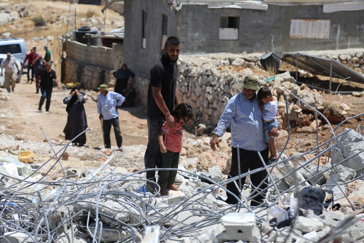 Israeli occupation forces demolish the home of Ibrahim Ziada in the village of Wadi Rahhal, south of Bethlehem in the occupied West Bank, on July 31, 2025. Rubble, personal belongings, and furniture are seen scattered at the site as family members look on in grief and frustration. Human rights organizations and Palestinian residents denounce the demolitions as part of a broader strategy of displacement and land control.
