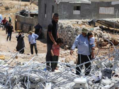Israeli occupation forces demolish the home of Ibrahim Ziada in the village of Wadi Rahhal, south of Bethlehem in the occupied West Bank, on July 31, 2025. Rubble, personal belongings, and furniture are seen scattered at the site as family members look on in grief and frustration. Human rights organizations and Palestinian residents denounce the demolitions as part of a broader strategy of displacement and land control.