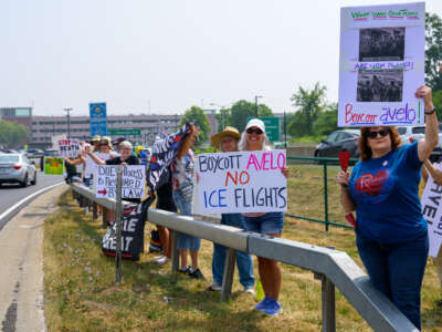 A rally near the Albany International Airport along Albany Shaker Road on July 26, 2025, in Colonie, New York. Protesters called on Albany County to drop Avelo Airlines from the airport roster because of its participation in ICE deportation flights.