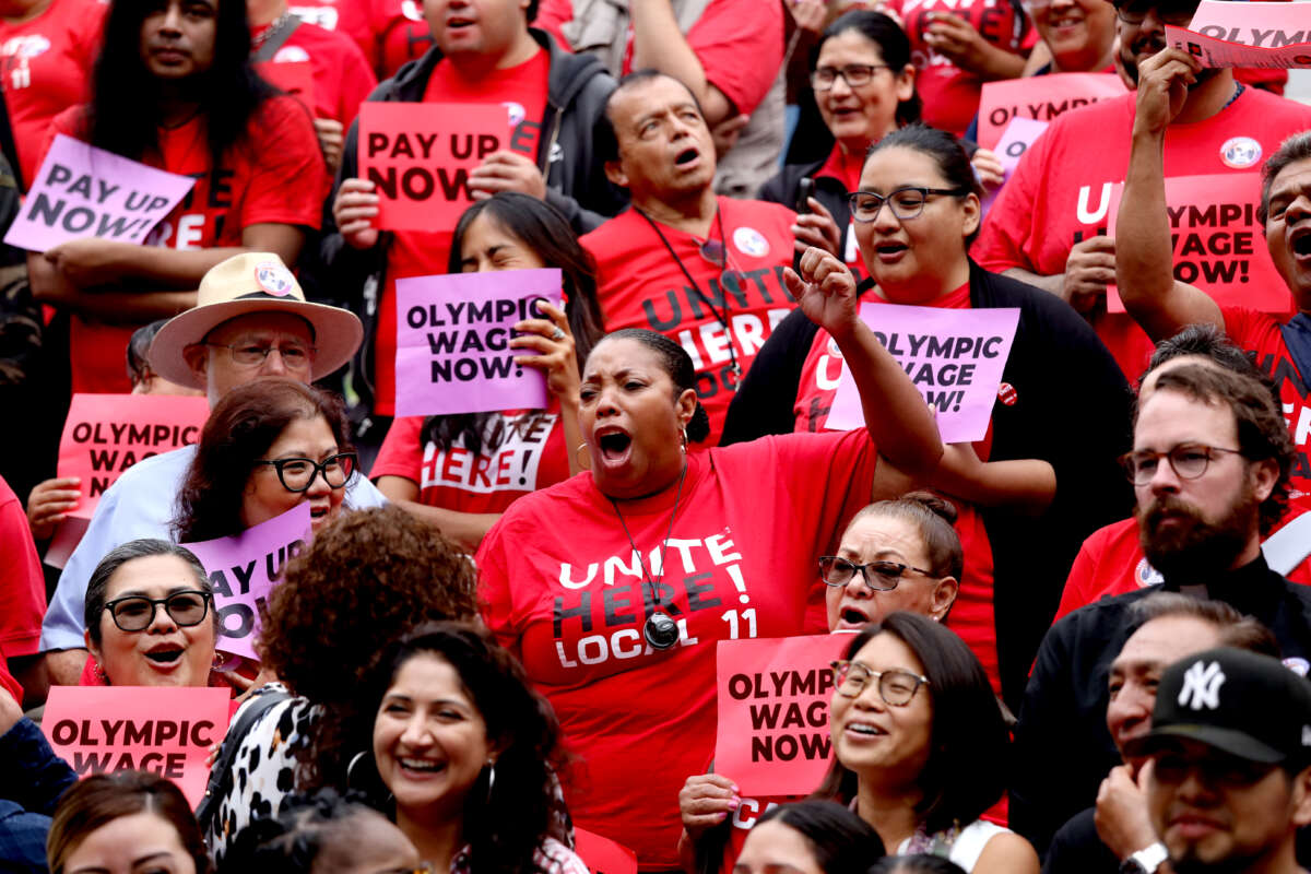 Union leaders and members celebrate the defeat of a measure to overturn the hotel and airport $30 per hour minimum wage at Los Angeles City Hall on September 9, 2025, in Los Angeles, CA.