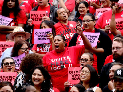 Union leaders and members celebrate the defeat of a measure to overturn the hotel and airport $30 per hour minimum wage at Los Angeles City Hall on September 9, 2025, in Los Angeles, CA.