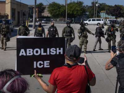 Demonstrators protest outside of an immigration processing center on September 26, 2025, in Broadview, Illinois.