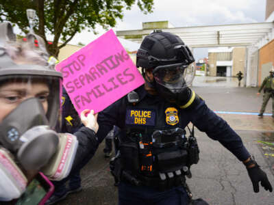 Federal agents clash with anti-I.C.E. protesters at the Immigration and Customs Enforcement building on October 12, 2025, in Portland, Oregon.