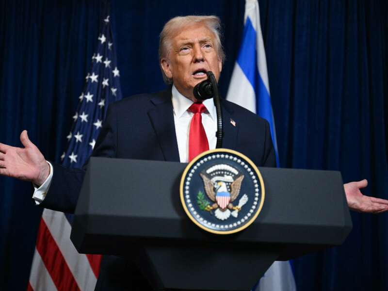 Donald Trump speaks during a joint press conference with Israeli Prime Minister Benjamin Netanyahu (off frame) at Trump's Mar-a-Lago residence in Palm Beach, Florida, on December 29, 2025. The two leaders discussed Iran, with Trump saying that if Tehran rebuilt its nuclear facilities, the United States would "knock them down."