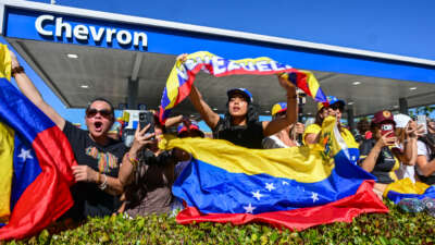 People react to the news of the US's capture of Venezuelan President Nicolas Maduro, in Doral, Florida, on January 3, 2026.