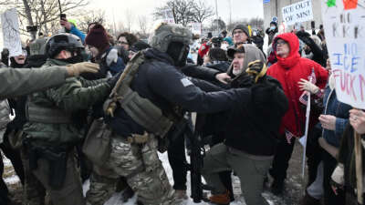 Federal agents clash with protesters outside the Bishop Henry Whipple Federal Building in Saint Paul, Minnesota, on January 8, 2026 following the ICE-perpetrated killing of Renee Nicole Good in Minneapolis on January 7.