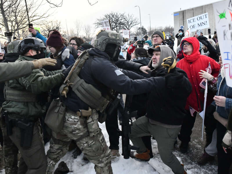 Federal agents clash with protesters outside the Bishop Henry Whipple Federal Building in Saint Paul, Minnesota, on January 8, 2026 following the ICE-perpetrated killing of Renee Nicole Good in Minneapolis on January 7.