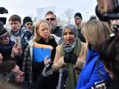 (L-R) Representative Kelly Morrison, a Democrat from Minnesota, Representative Ilhan Omar, a Democrat from Minnesota, and Representative Angie Craig, a Democrat from Minnesota, speak with reporters after visiting with immigrations officials at the Bishop Henry Whipple Federal Building after in Minneapolis, Minnesota, on January 10, 2026.